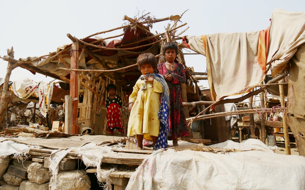 Pakistani children stand outside their makeshift home Oct. 16, 2018, near Karachi. (CNS/EPA/Shahzaib Akber) Pakistani children stand outside their makeshift home Oct. 16, 2018, near Karachi. (CNS/EPA/Shahzaib Akber)